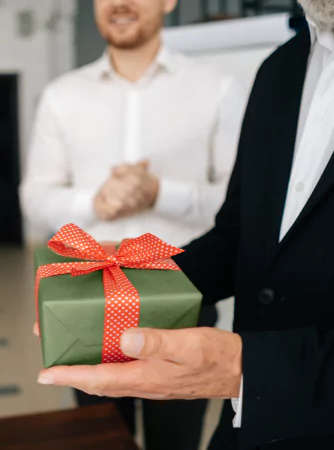 person handing out a gift